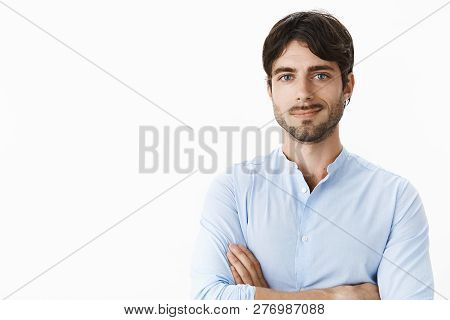 Waist-up Shot Of Successful Delighted Good-looking Young Male With Blue Eyes And Beard Smiling Satis