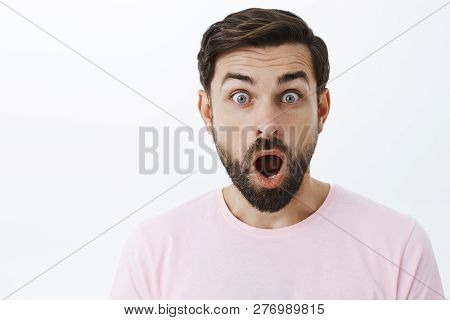 Close-up Shot Of Impressed And Shocked Stunned Caucasian Guy With Beard Dropping Jaw From Amazement 