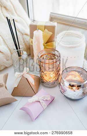 Beautiful Gift Box With Bow And Candles On White Windosill Background, Valentine's Day And Mother's 