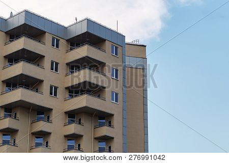 Modern Condominium Building Real Etate In City With Blue Sky.