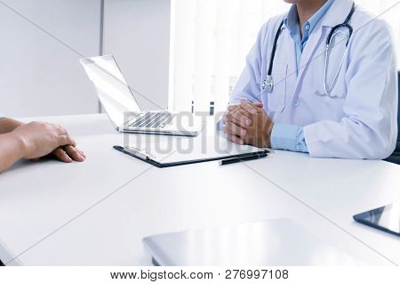 Professional Medical Doctor In White Uniform Gown Coat Interview Patient Are Discussing In Hospital
