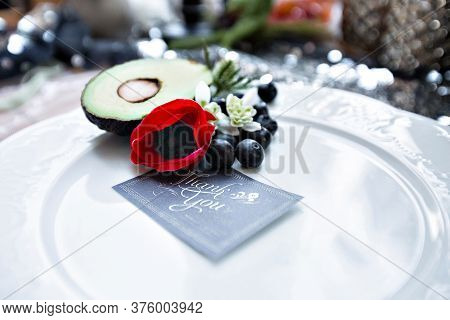 Decoration Of Festive, Wedding Table. Decorated With Avocado Red Anemone Blueberry Small White Flowe
