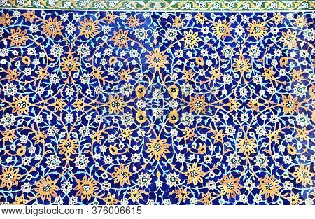 Detail of traditional persian mosaic wall with floral ornament in Shrine Ensemble, mausoleum and khaneghah of Sheikh Safi al-din, Ardabil, Iran. UNESCO world heritage site