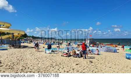 Wladyslawowo, Poland - July 12, 2020: People Are Resting On The Beach On A Sunny Day In Wladyslawowo