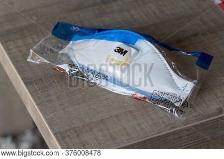 Brecht/belgium - May 5 2020: A Portrait Of A Dust Mask Still In Its Packaging During The Corona Pand