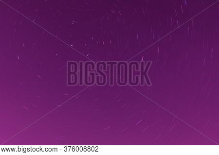 Background Of Round Or Circular Star Track Or Trajectory On The Red, Pink Or Rose Clear Night Sky. S
