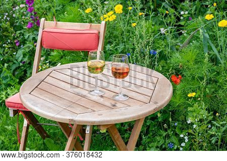 Tasting Of Dutch Sparkling Rose And Dry White Wine On Vineyard In Summer