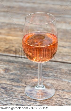 Tasting Of Dutch Rose Wine On Vineyard In Summer