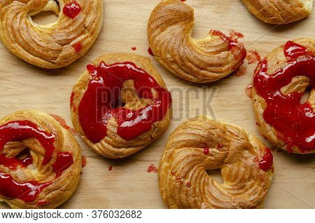 A Homemade Cruller Donuts With Strawberry Jam