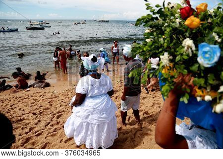 Salvador, Bahia / Brazil - February 2, 2015: Supporters Of Candomble Are Seen On The Rio Vermelho Be