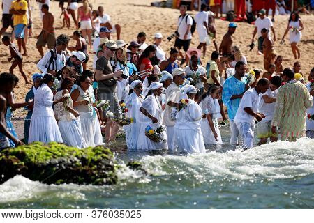 Salvador, Bahia / Brazil - February 2, 2015: Supporters Of Candomble Are Seen On The Rio Vermelho Be