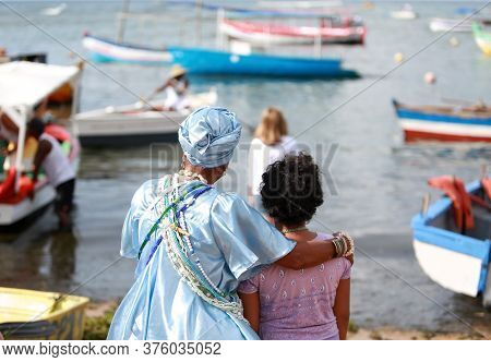 Salvador, Bahia / Brazil - February 2, 2015: Supporters Of Candomble Are Seen On The Rio Vermelho Be