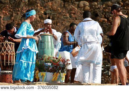 Salvador, Bahia / Brazil - February 2, 2015: Supporters Of Candomble Are Seen On The Rio Vermelho Be