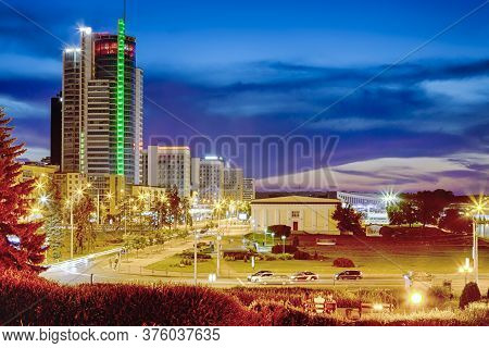 Belarus Travel Destinations. Minsk City Night View With Pobediteley Avenue And Newly Built Houses At
