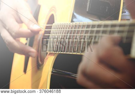 Man Play Guitar,  Acoustic Guitar, Used To Play Music And Notes.