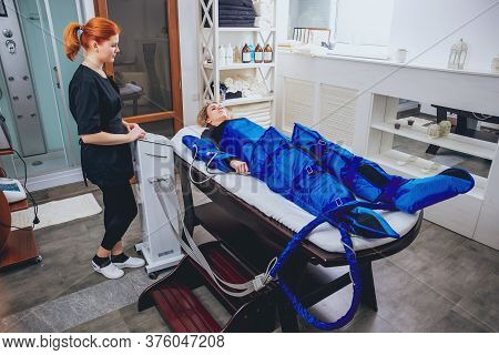 Pressotherapy Machine On Woman In Beauty Center