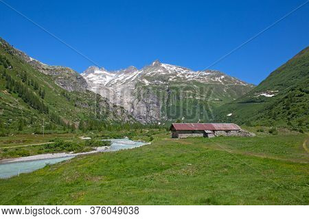 Rhone glacier, source of Rhone river, melting and retreating due to global warming. Rhone glacier is loosing up to 2 meters in length every year.