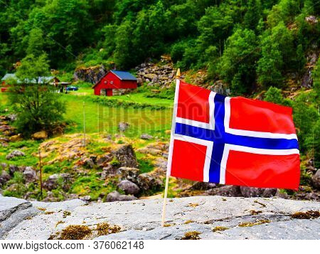 Norwegian Flag Waving Outdoor On Green Nature
