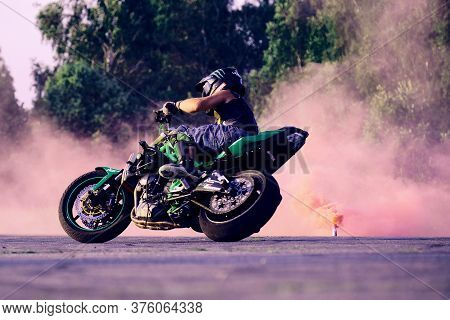 Moscow, Russia - 12 Jul 2020: Moto Rider Making A Stunt On His Motorbike. Stunt Motorcycle Rider Per