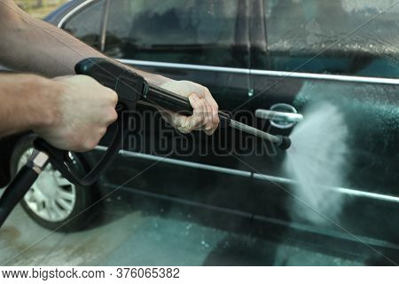 A Man Washes A Car In A Manual Car Wash. Clear Car