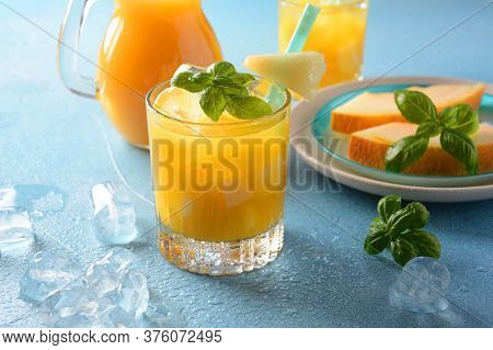Refreshing Drinks And Citrus Juices  With Ice Cubes, Mint And Melon. Summer Concept