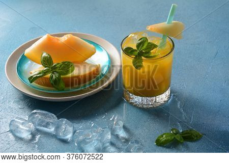 Refreshing Drinks And Citrus Juices  With Ice Cubes, Mint And Melon. Summer Concept