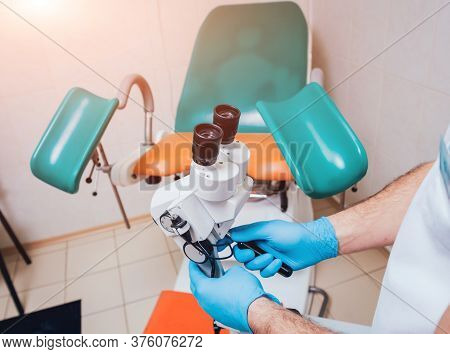 Gynecologist Working With Colposcope In Clinic. Medical