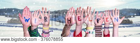 Kids Hands Holding Word Wir Helfen Means We Help, Snowy Winter Background