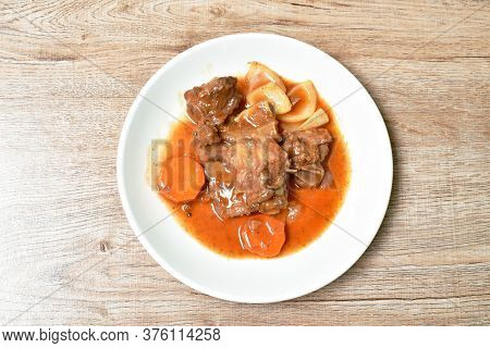 Fried Pork Bone With Slice Carrot And Onion With Swet And Sour Sauce On Plate