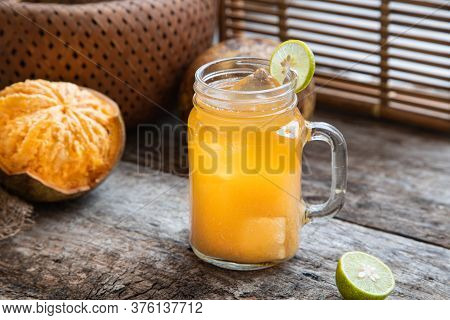 Exotic Fruit Juice From Bel Fruit Or Wooden Apple Called In India Bel Ka Sharbat. Cold Fruit Drink W