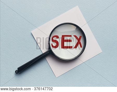 Word Sex On Table Throgh Magnifier Glass