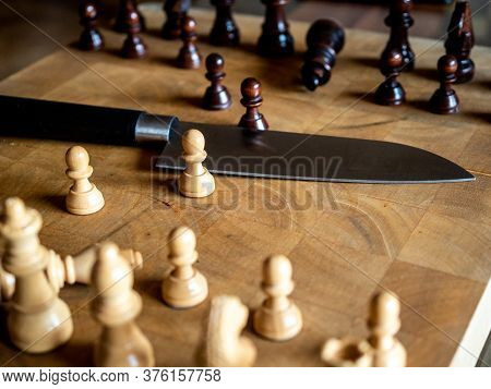 Chess Pieces And Knife