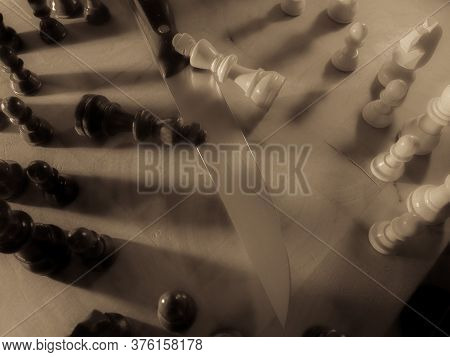 Chess Pieces And Knife