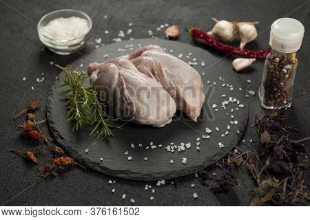 Raw Quail Meat On Kitchen, Cooking Gourmet Bird. Healthy Diet Recipe.