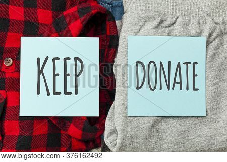 Stack Of Old Clothes To Discard (declutter) Or Keep. Recycle Clothes, Eco Cotton.