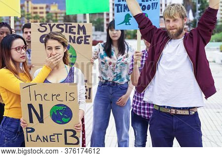 Young Activist Fighting Against Climate Change. Girl Covering Her Friend's Mouth. No Freedom Express