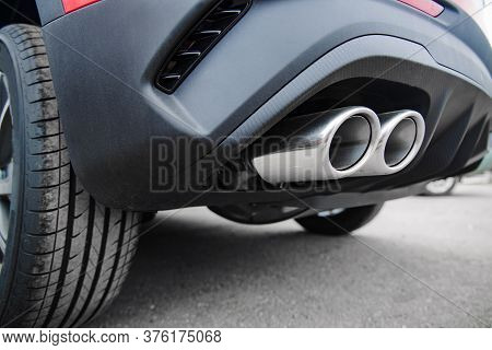 Car Exhaust Pipe At Shallow Depth Of Field