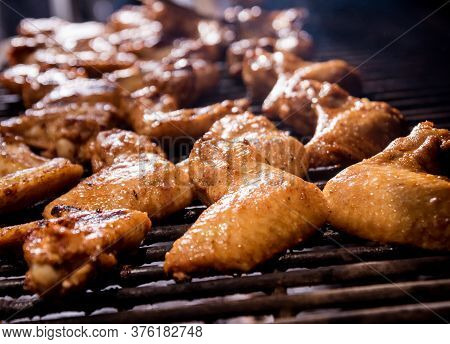 Fried Chiken Wings At Grill Barbecue. Restaurant.