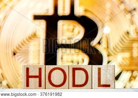 Hodl Btc Concept. Wooden Blocks With Hodl Inscription With Bitcoin On The Background