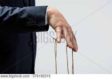 Cropped View Of Puppeteer With Strings On Fingers Isolated On Grey