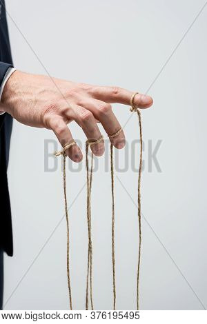 Partial View Of Puppeteer With Strings On Fingers Isolated On Grey