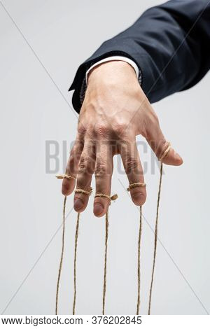 Partial View Of Puppeteer With Strings On Fingers Isolated On Grey