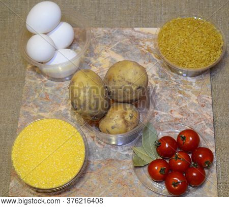 Ingredients For Quick Cooking Of The Second Course For Lunch: Eggs, Potatoes, Bulgur, Cherry Tomatoe