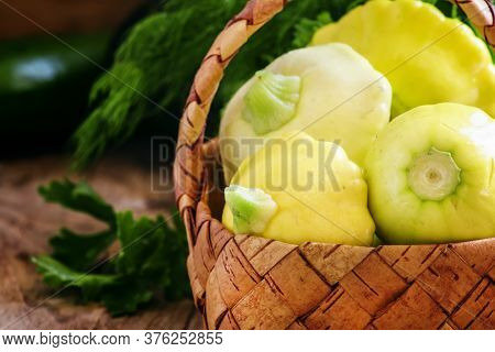 Small Yellow Pattypan Squash Or Zucchini In A Wicker Basket, Vintage Wooden Background, Selective Fo