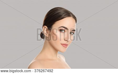 Young Woman With Beautiful Face On Light Background. Banner Design