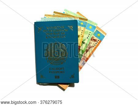 Kazakhstan Passport With National Currency Tenge Isolated On White Background. Kz Passport And Kazak