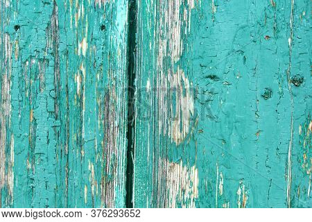 Old Rustic Painted Cracky Green, Turquoise Wooden Texture Or Background.
