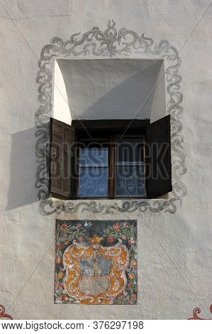 Old House With Fresco And Wooden Window In The Ancient Village Of Guarda, Scuol Municipality, Engadi