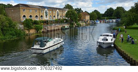 St Neots, Cambridgeshire, England - July 04, 2020:  The Rive Ouse At St Neots With River Cruisers An