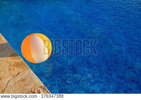 Rubber Air Yellow White Inflatable Ball And Toy For Swimming Pool In Transparent Blue Water. Multi-c
